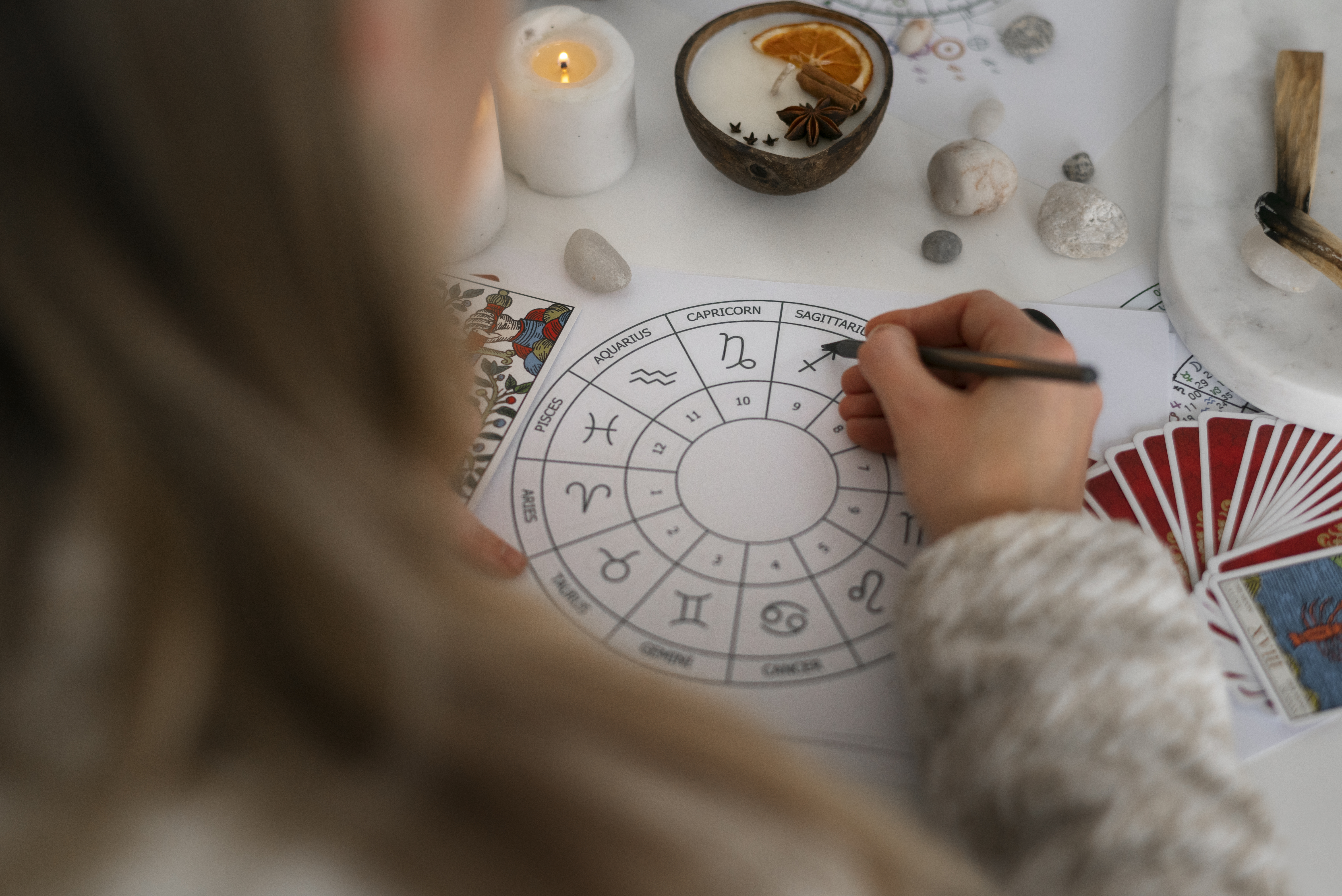 high-angle-woman-reading-tarot-home (1)